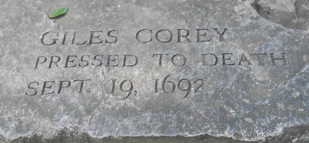 Headstone reading Giles Corey, Pressed to Death, September 19, 1692